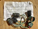 Hiniker Headlight Adapter - 38813040. Fixed Price $95.00.